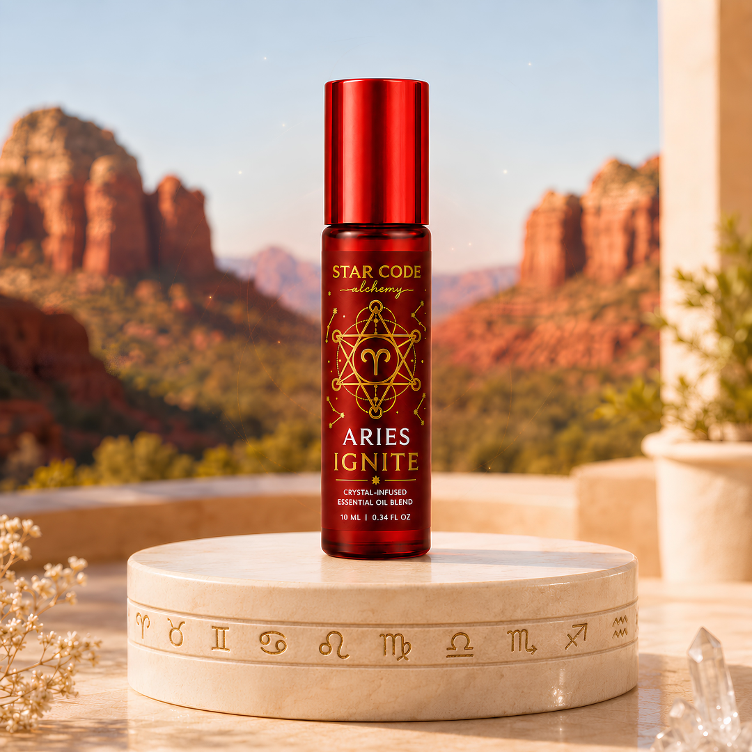 Star Code Alchemy Aries Ignite essential oil roll-on displayed on a zodiac pedestal with Sedona red rocks and clear quartz